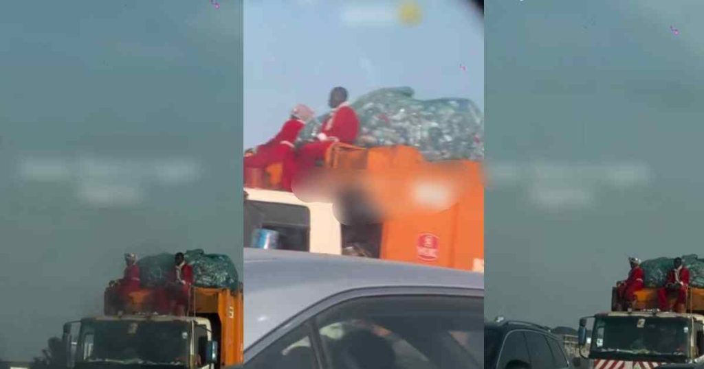 a-motorist-is-stunned-after-spotting-men-in-santa-claus-costumes-sitting-a-on-waste-truck-in-lagos-(watch)