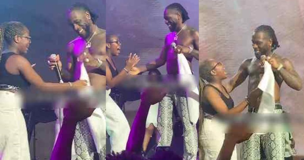 “na-man-dey-do-man”-–-online-users-react-to-burna-boy-hugging-a-female-fan-on-stage-at-a-recent-concert-(watch)
