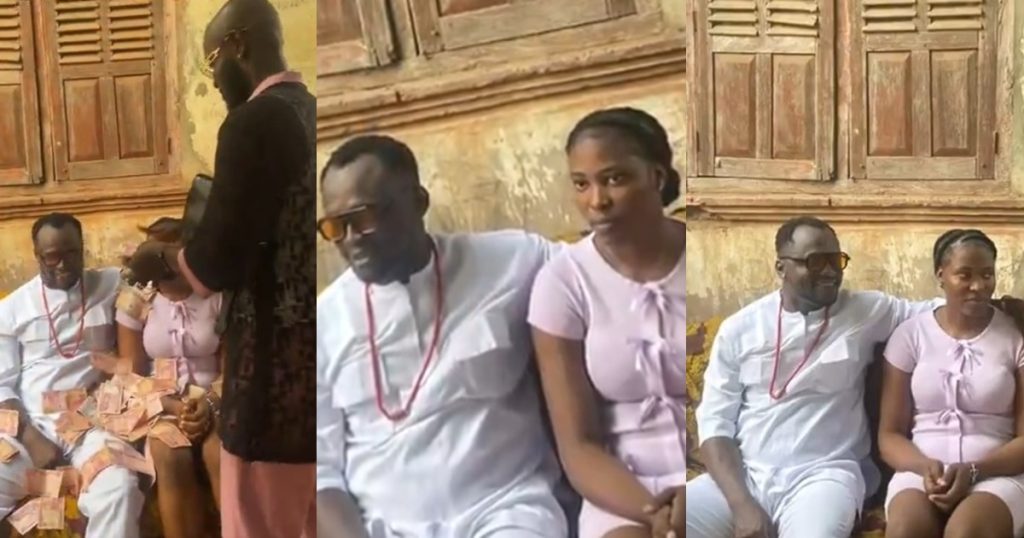 viral-video-of-a-bride-looking-cluɘless-at-her-wedding-ceremony-while-being-sprayed-naira-notes-raises-concern-(watch)