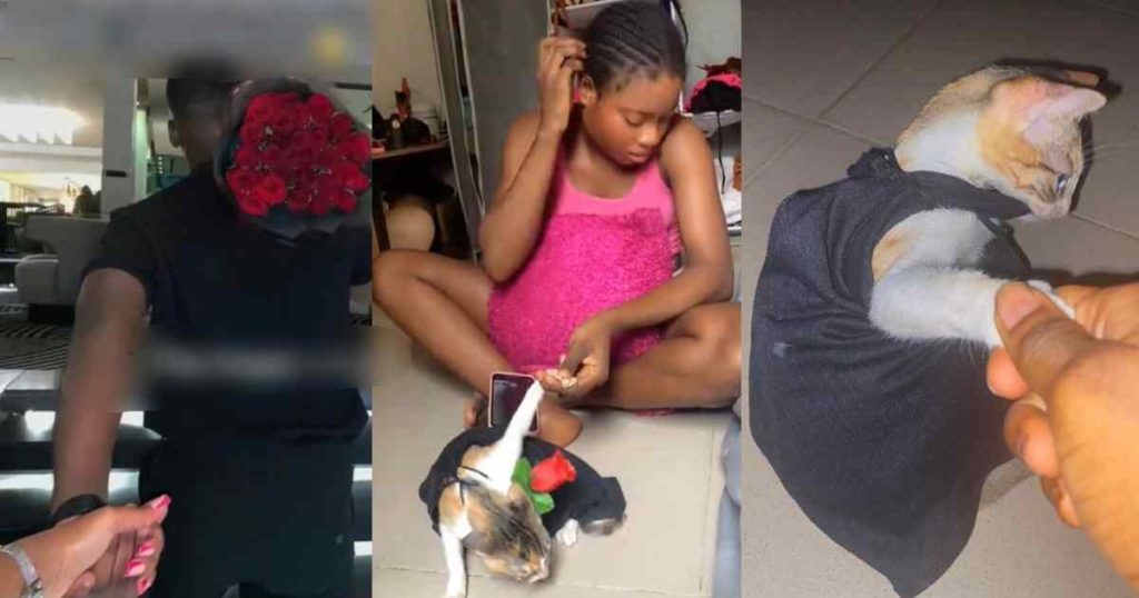 hilarious-moment-single-lady-struggles-with-her-pet-cat-to-recreate-a-romantic-picture-(watch)
