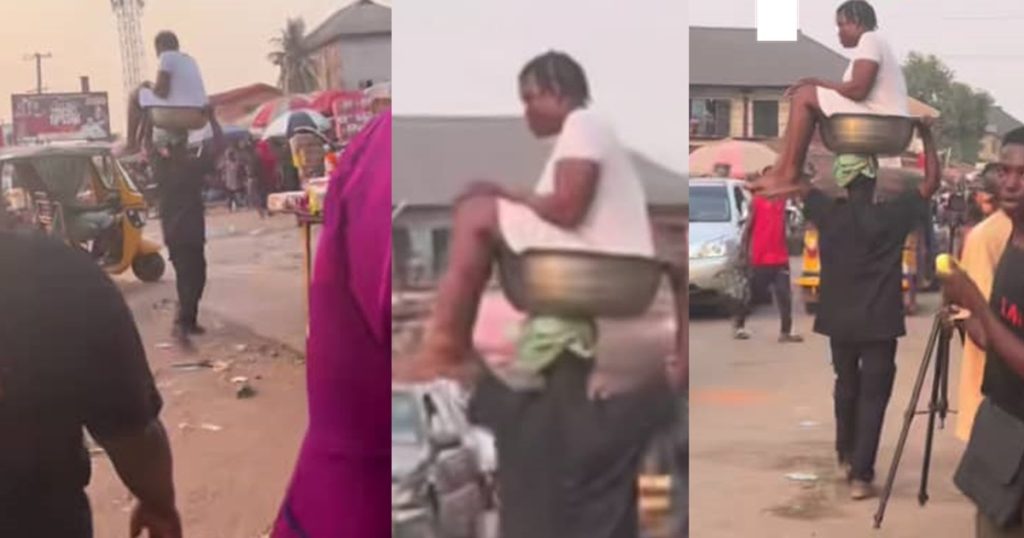 man-goes-viral-for-carrying-his-alleged-girlfriend-in-an-iron-bowl-while-walking-(video)